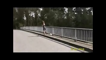 Nina flashing on a bridge