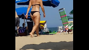 Candid on this little slut at the beach