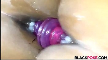 Black babe fucks her mounted dildo