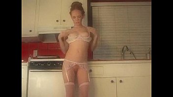 Heather Carolin stripping in the kitchen