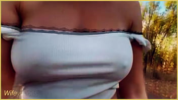 Amazing MILF flashing her tits on public bike ride