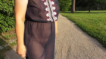 Hairy mature in transparent dress flashing in the park