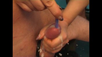Mistress inserting toothrbush in a guy'_s cock while she jerks and makes him cum