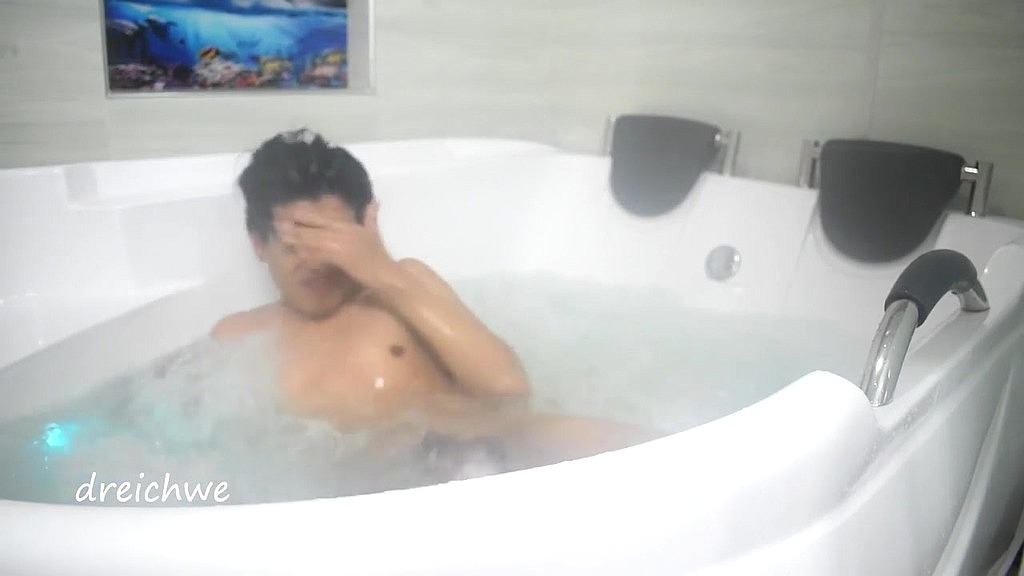 taking a bath in the tub