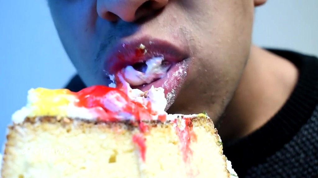 eating cake with his mouth
