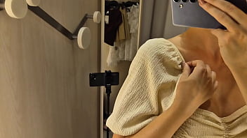 Hot blonde MyCandyAlice trying on sexy clothes in a mall. I try on sexy clothes in a fitting room and show her boobs