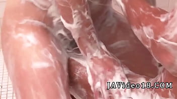 Brunette Anne with gigantic mounds gives a oral pleasure to a rod in front of the camera while in the shower - Asian porn at its hottest!