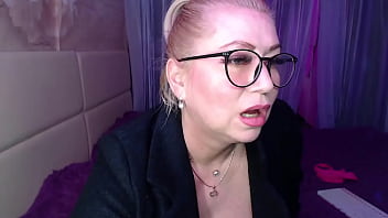 A cool busty vulgar mature whore in glasses with a ponytail on her head...