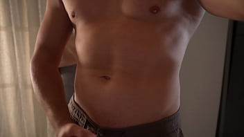 Strong guy posing at camera and cums on his belly