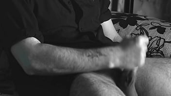 The boy jerks off close-up with a condom and cums loudly into it.