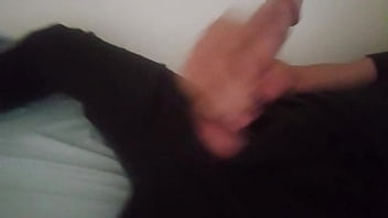Horny guy in black pants moaning and jerking off his big cock after work until he cums