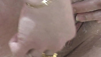 Beautiful cute sweet sexy girl Assol in bathroom shaves pussy close up in bra without panties. Wet pussy. Handjob