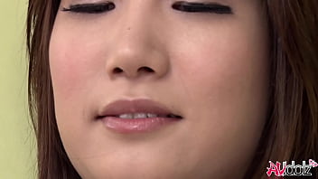 Japanese woman Mikuni Maisaki loves to tease herself on the couch with a sex toy.