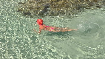 Pink bikini in a beautiful bay