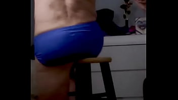 Onjon70 before bed on stool in blue briefs with television on