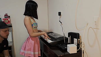 Beautiful young woman in pink skirt fucked up wanting to play piano