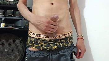 young man with a big uncut cock masturbating