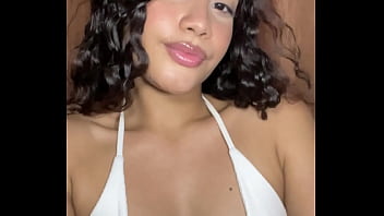 Innocent girl with a tender face masturbates her pussy in a miniskirt