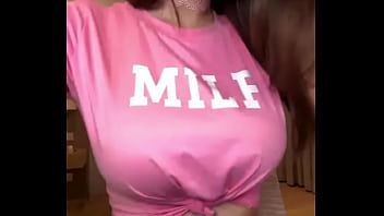 MILF with big tits in a pink T-shirt