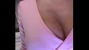 Stepmom in pink caresses her big tits