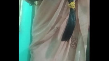 Indian trans woman Gaurisissy pressing and milking her boobs in pink saree