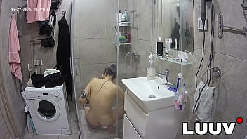 LUUV. Tattooed Alice gets ready for the evening reality show segment in the shower