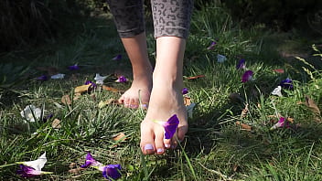 Crushing Flowers Barefoot In The Grass