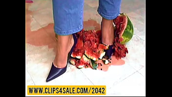 Watermelon crushing under high heels