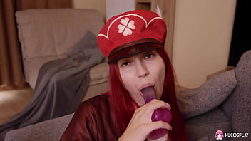 Horny redhead slut Toffina plays with a purple toy.
