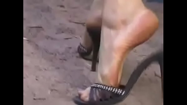 Lana walking in high heel sandals