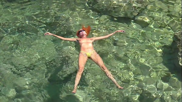 Yellow swimming trunks and blue water