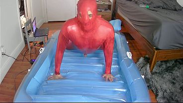 Inflatable oil catsuit fuck