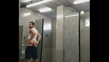 I almost got caught exposing myself in the gym bathroom, and the guys almost caught me.