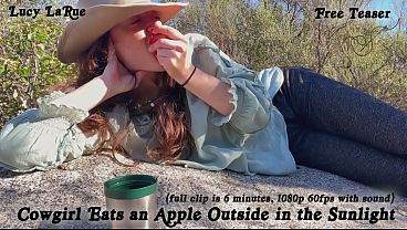 &quot_Cowgirl Eats an Apple Outside in the Sunlight&quot_