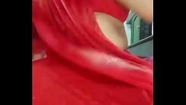 Indian Gay Crossdresser Bottom Gaurisissy pressing and playing with her big boobs in red saree with heavy jwellery